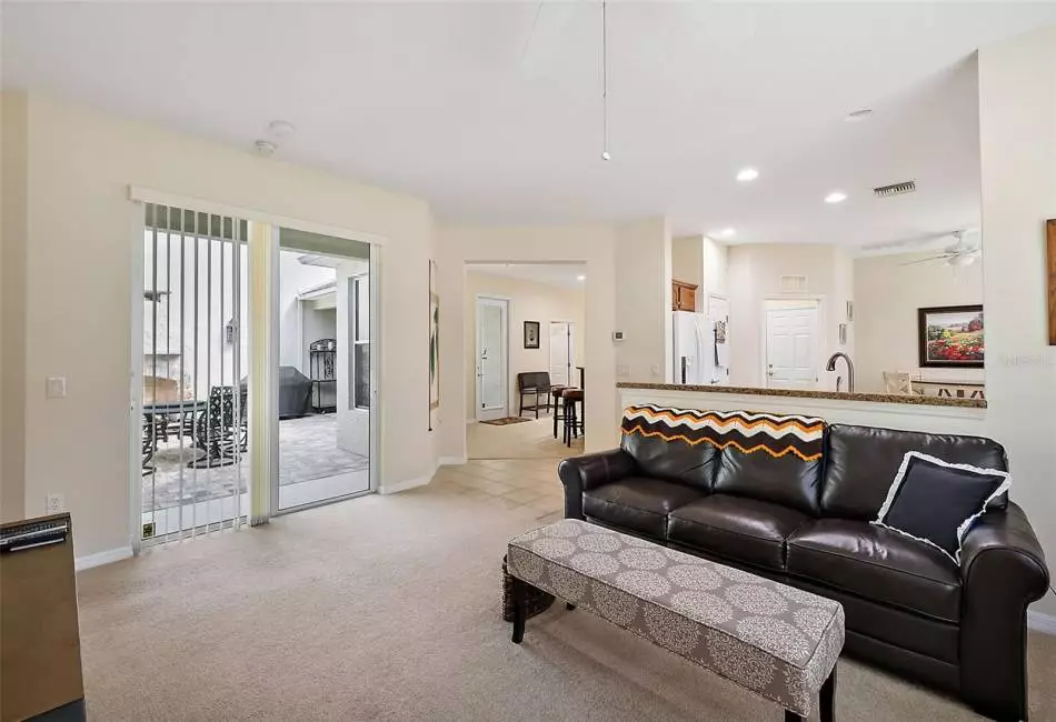 Oversized Sliding Glass Doors open to the Beautiful Court Yard. Carpet is throughout the house except the Wet Areas.
