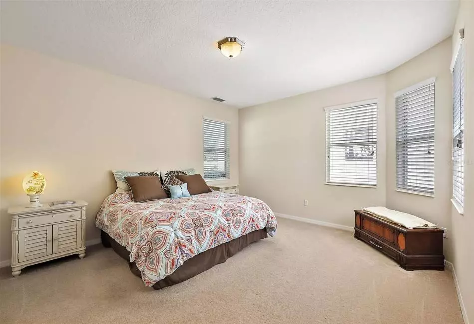 Master Bedroom has Space Galore with Bay Windows that overlook the Tuscany Style Court Yard.
