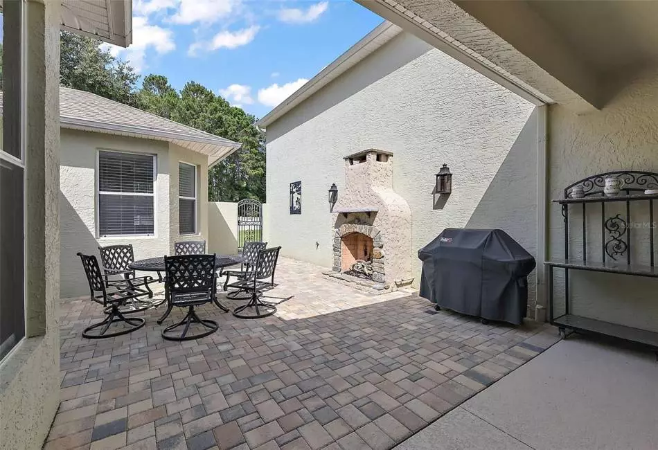 This is where you will live year round... Beautiful Private covered and Open Air to enjoy as you please.Paved Flooring, Beautiful Gas Fireplace & Gas Lanterns to set the mood for those cool Florida Evenings..