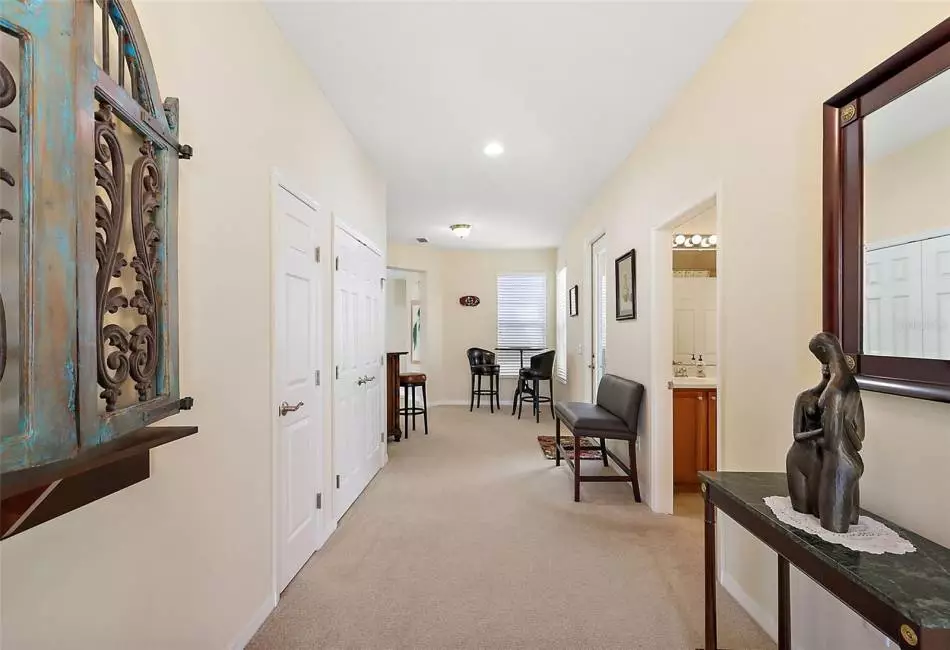 Beautiful Entry into the Home. Shows Coat Closet & Extra wide Linen Closet Doors on left.