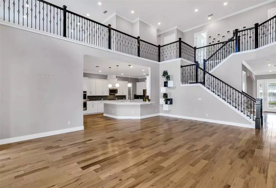 Family Room Highlighting beautiful wooden handrail with decorative spindles