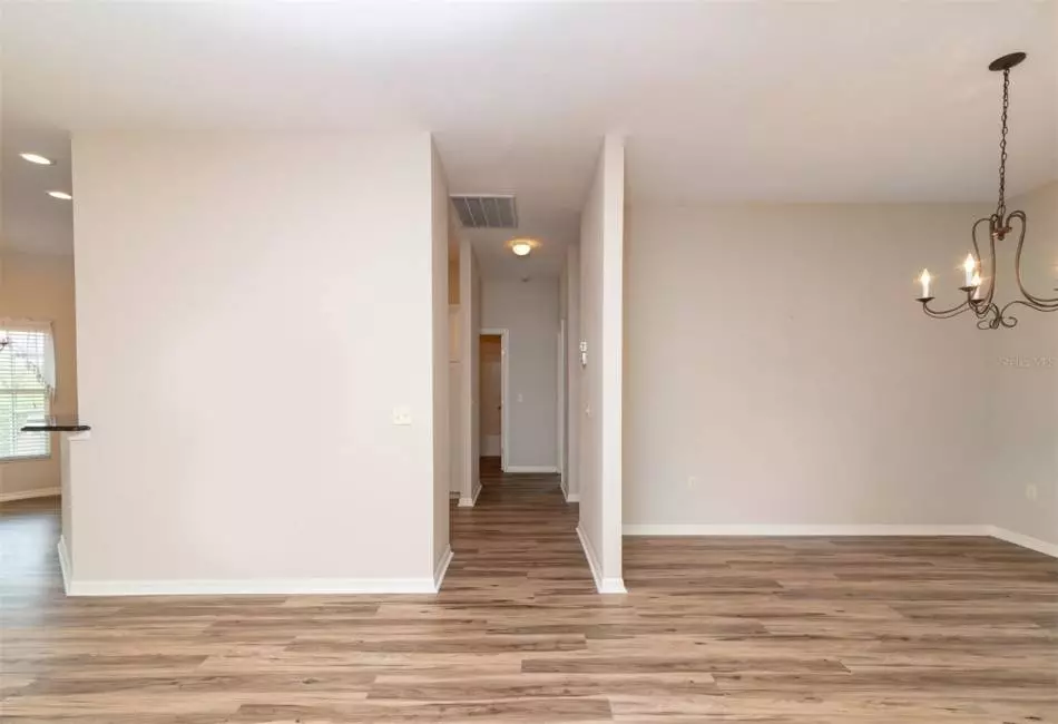 Hallway to split floorplan for guest bedrooms