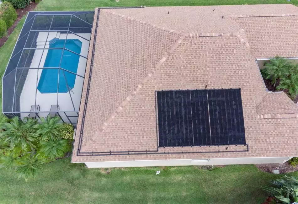 Back & Side of home showing solar heater for pool
