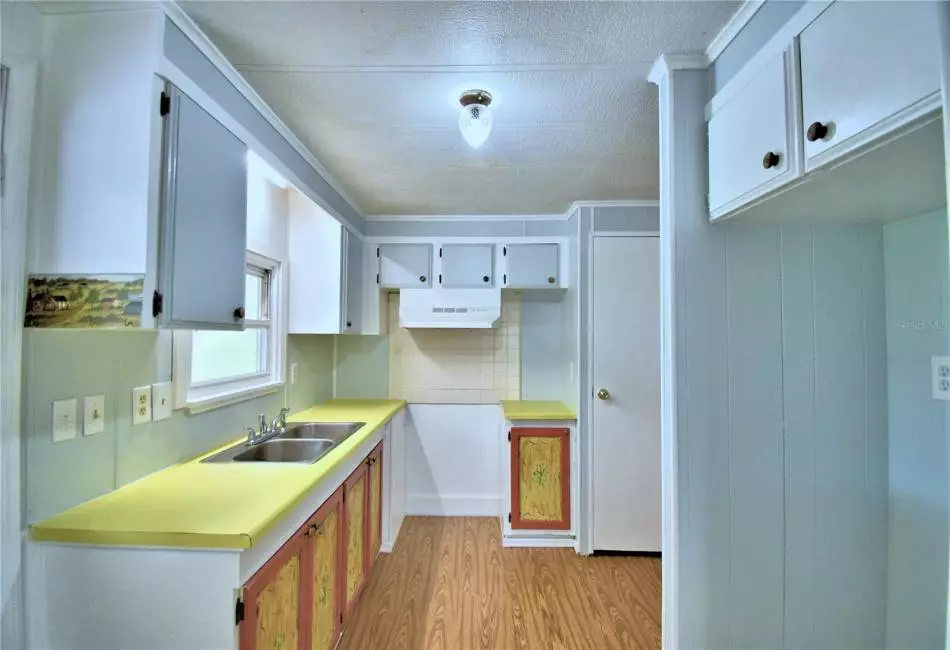 The dining room has a built-in buffet, shelves and cabinets.