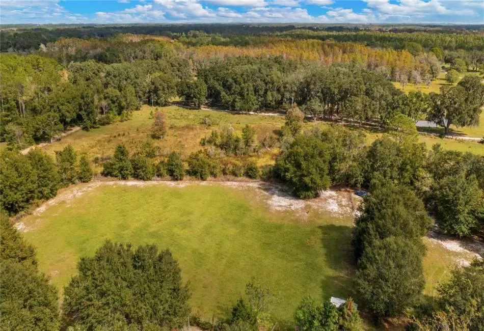 Aerial of 2610 Stephens Rd Groveland, FL 20acres and 5/2 home with HUGE outbuiding