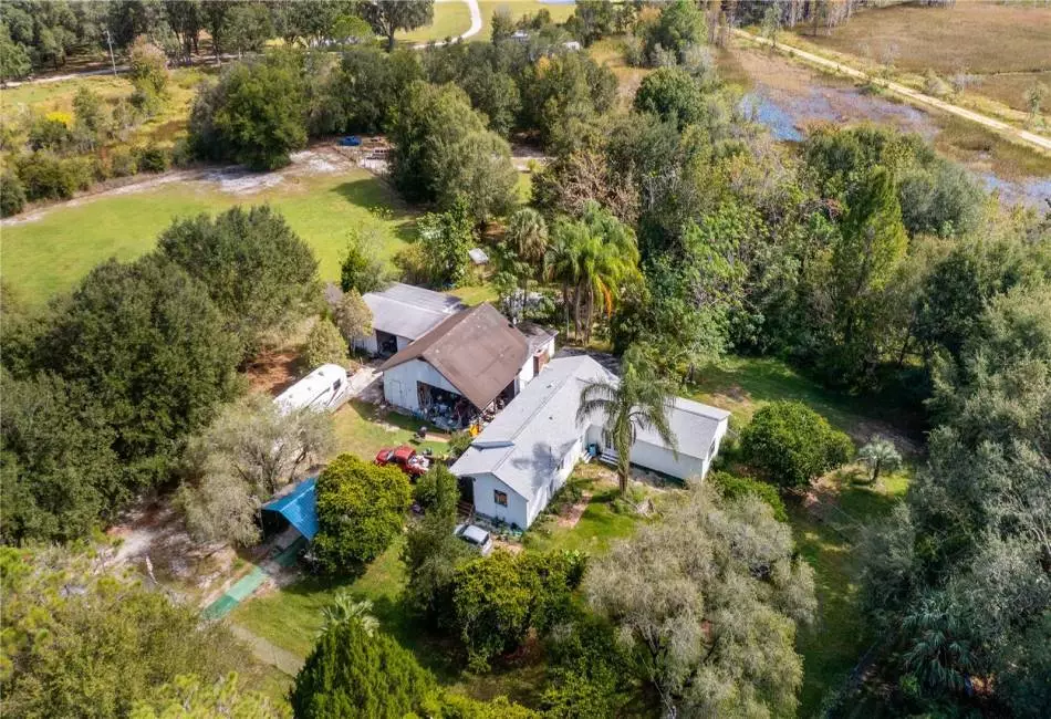 Aerial of 2610 Stephens Rd Groveland, FL 20acres and 5/2 home with HUGE outbuiding