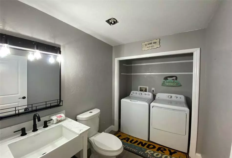 Laundry room with half bath