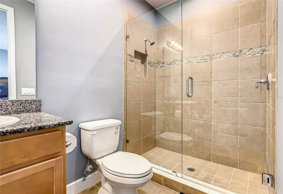 Bathroom in bedroom 4 with large shower