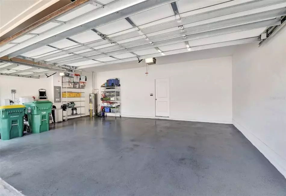 3 car garage with epoxy floor &  pull-down stairs