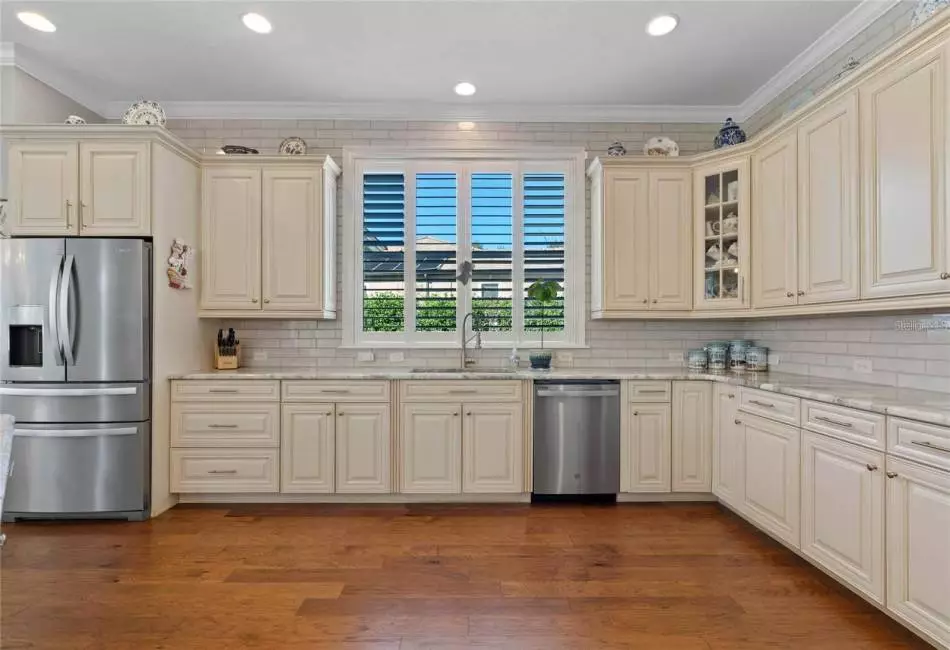 Light colored wood cabinets and stainless steel appliances