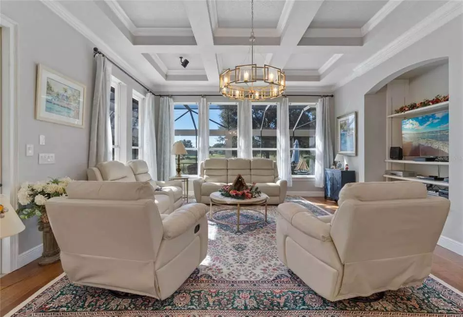 Coffered Ceilings and built-in Entertainment center are features of the Family Room...And, of course the great view!!