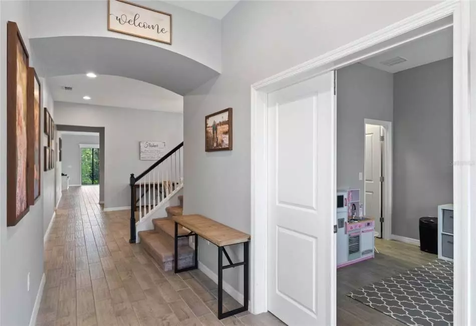 Welcoming Entry with WOOD PLANK TILE, Upgraded Paint Color and HIGH Ceilings!