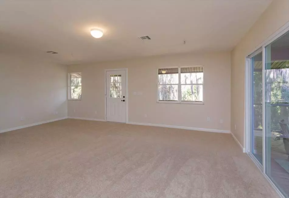 Oversized family room with room to create small 3rd bedroom if so desired.
