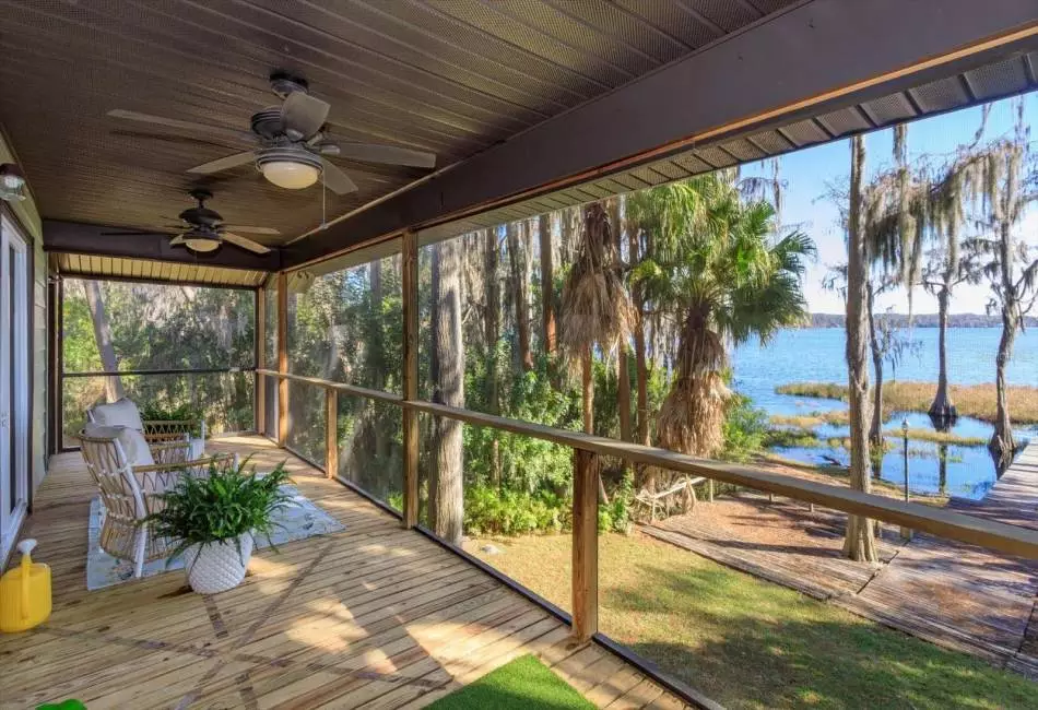 Elevated screened porch offers spectacular lake views.