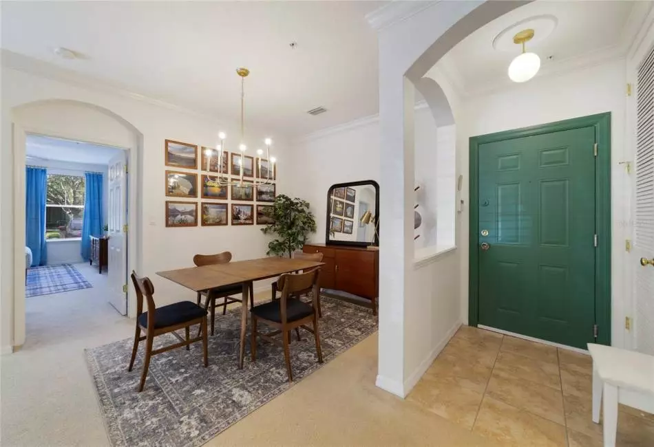 This light and bright OPEN CONCEPT features crown molding, dedicated living and dining spaces, spacious kitchen and TRIPLE SLIDING GLASS doors that access a SCREENED LANAI! Virtually Staged.