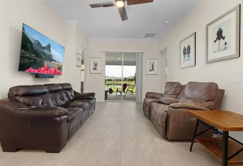 Desirable SPLIT BEDROOMS offer the owner a tranquil retreat in the main floor PRIMARY SUITE, topped with both crown molding and a lovely tray ceiling with direct access to the lanai, large WALK-IN CLOSET and must see private en-suite bath!