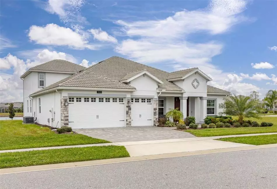 Live a life of effortless luxury in this Grande Charleston Estate home, perfectly situated in the Stoneybrook South community of Champions Gate with an array of exciting RESORT STYLE AMENITIES in addition to the exclusive GOLF CLUB MEMBERSHIP!
