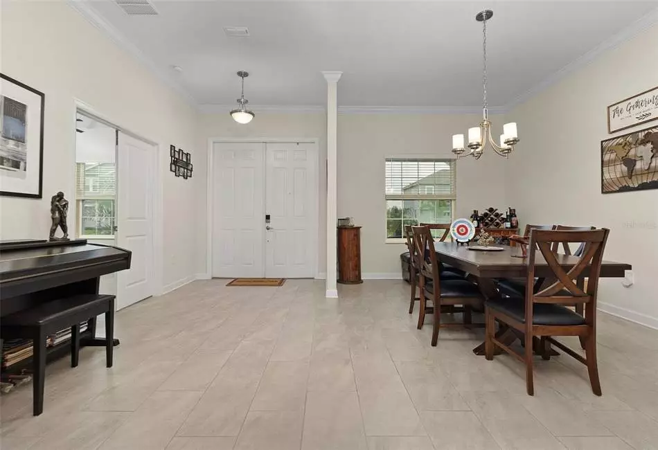 The kitchen is open to the family room with sliding glass door access to the covered paver lanai.