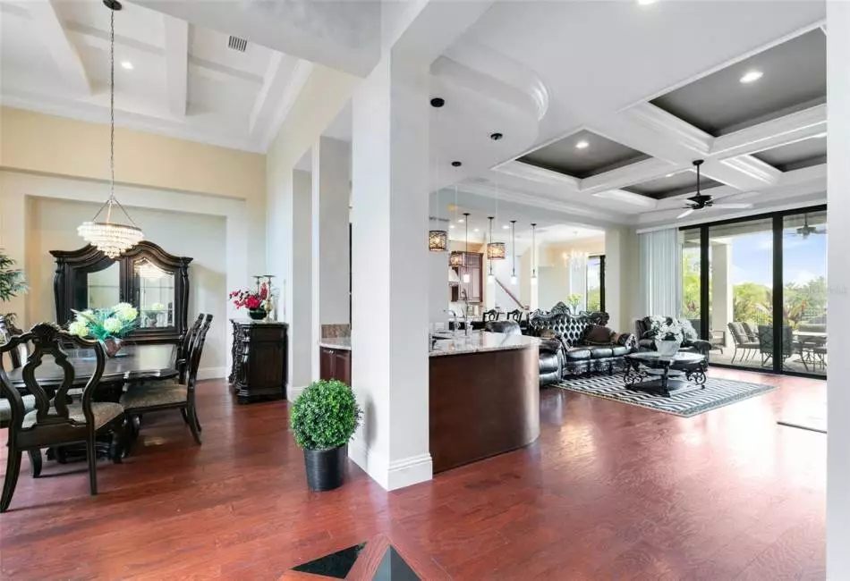 High ceilings featuring coffering welcome you into this gorgeous home.