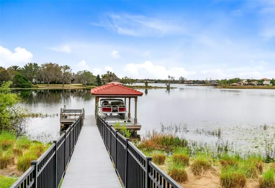 For water enthusiasts, a covered deck with a boat lift and electricity provides access to Lake Burden.