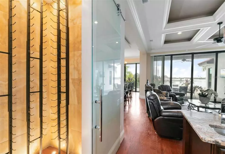 Directly adjacent to the wet bar is a large wine closet to store your favorite vinos.