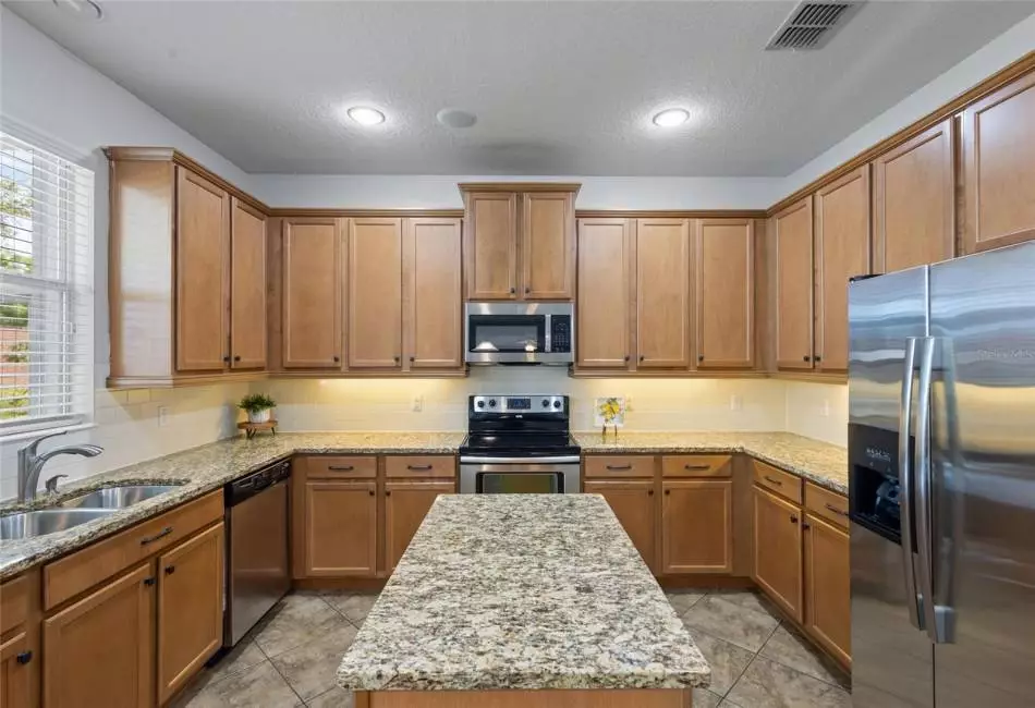 Kitchen, Granite Countertops, Backsplash, Stainless Steel Appliances, Tile Flooring
