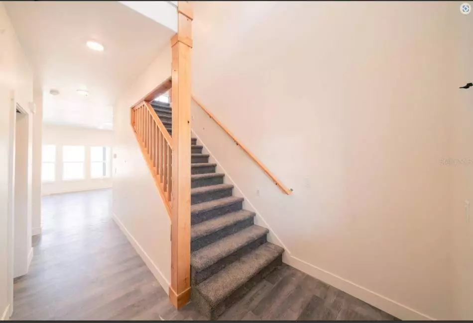 Stairwell Landing. Finishes may vary. Note Home is Planned with LVP up the stairs.