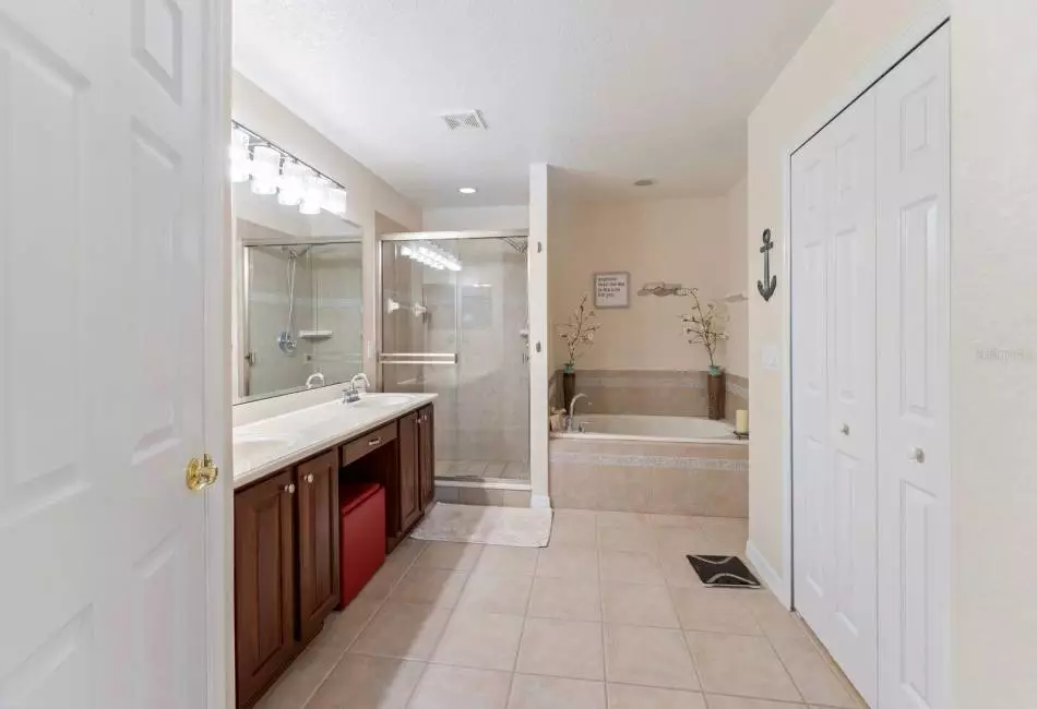 PRIMARY BATHROOM WITH DUAL SINKS, WALK IN SHOWER AND SOAKING TUB