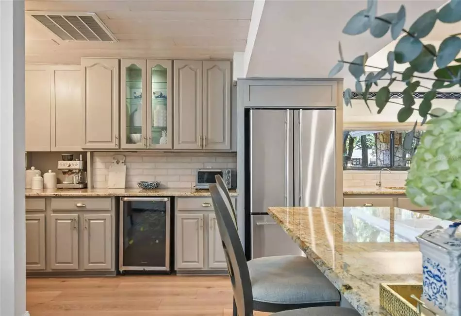 Large windows with views to the back porch.