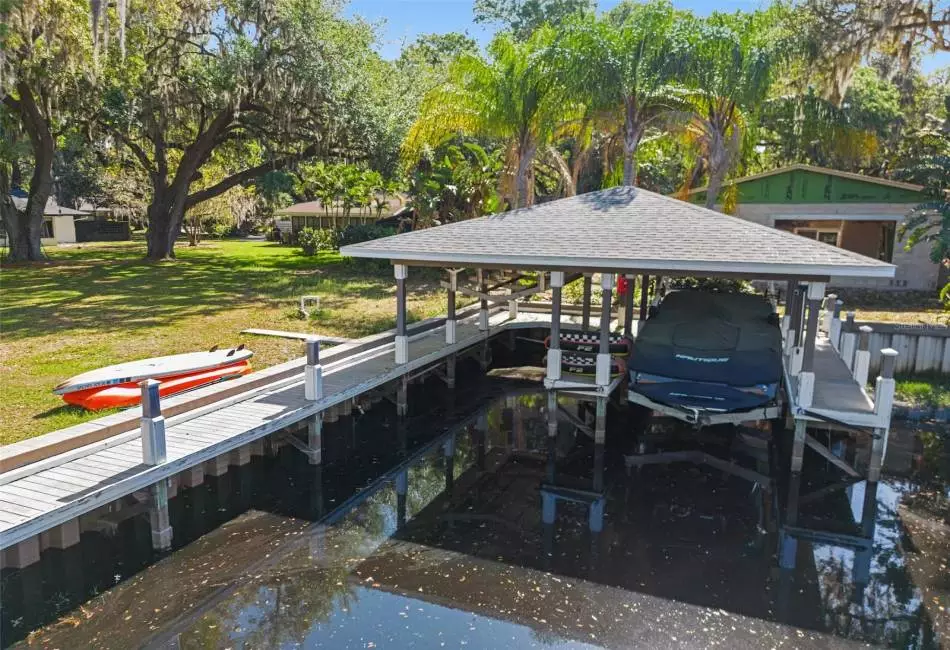 This boathouse is shared with the neighbor. Canal leads to Lake Toho, Lake Ajay, and Fells Cove