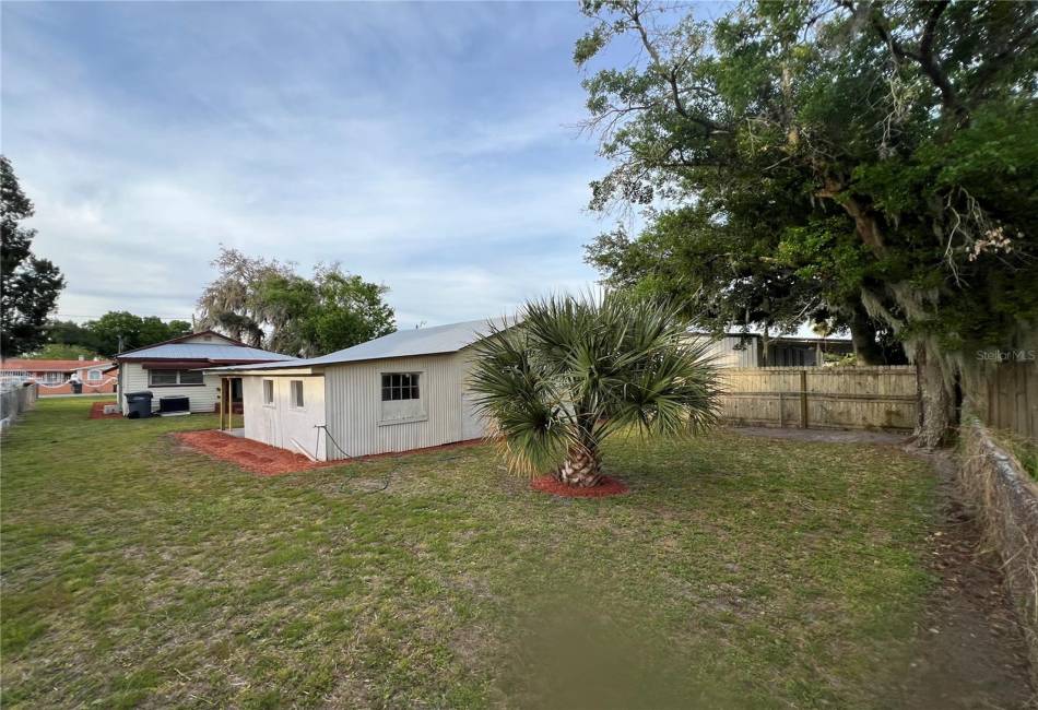 The patio, behind the Garage and Laundry.You can view the .159 acre lot.