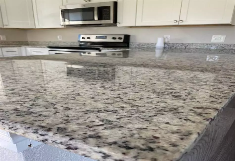 Kitchen peninsula with granite countertop