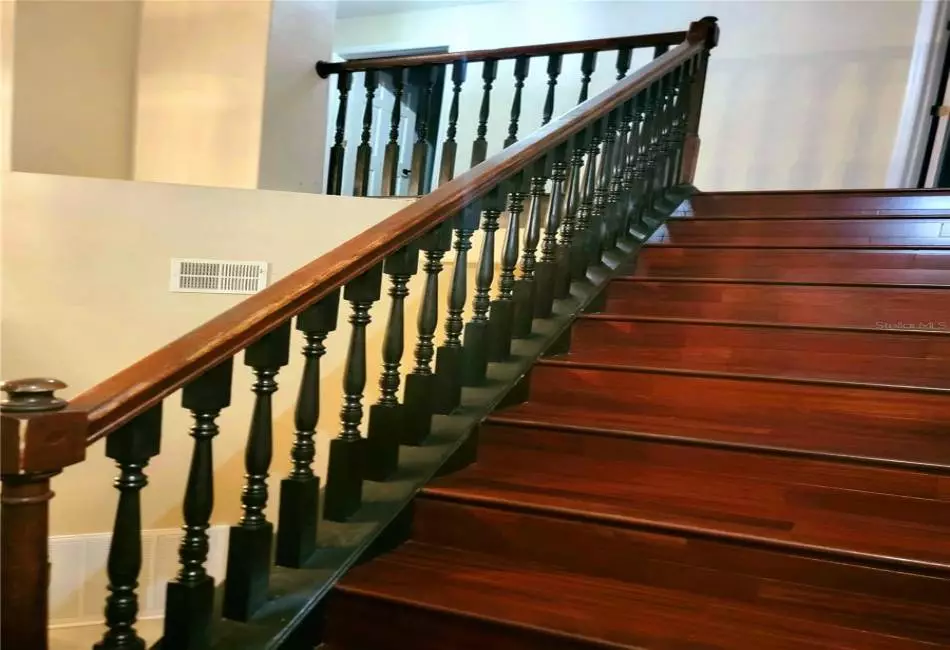 Custom stairs with Designer Black Spindle Millwork and Engineered Hardwood stairs.