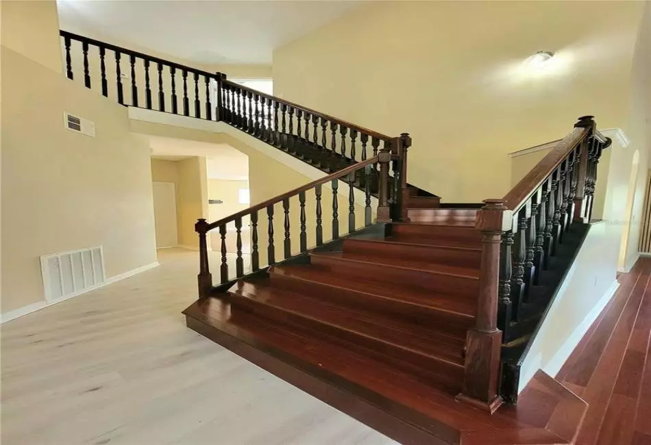 Stairs and Foyer with 19 ft ceilings