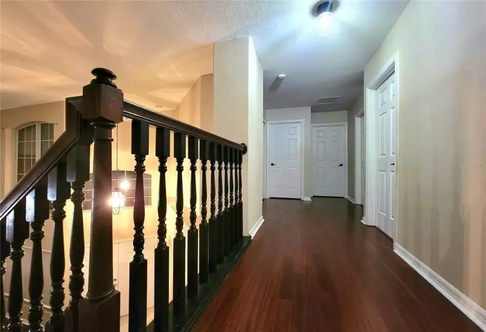 2nd Floor Hallway with Upgraded Designer Lighting, and Engineered Hardwood Floors.