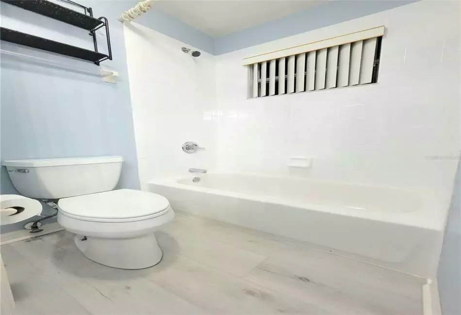 2nd Full Bathroom with separate shower with tub, lavatory, and large vanity with dual sinks, Upgraded Designer Fixtures and Lighting, and Luxury LVP Floors.