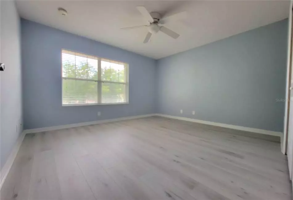 Bedroom 4 with Large Spacious Closet, Ceiling Fan and Luxury LVP Floors.