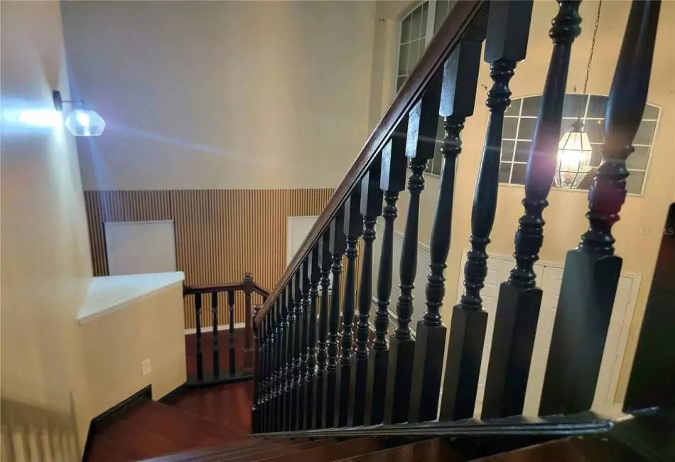 Upgraded Designer Lighting, Custom stairs with Designer Black Spindle Millwork and Engineered Hardwood stairs.