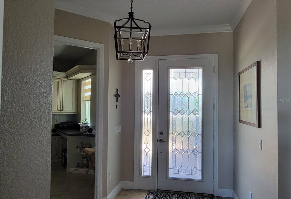 Beautiful Beveled Glass Door Entry Leads to Foyer