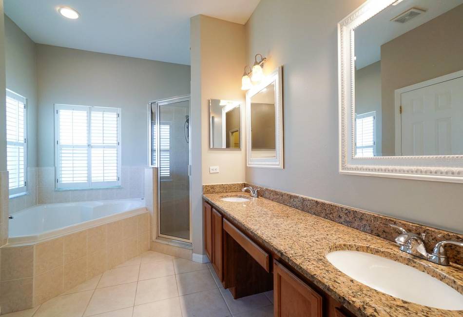primary bathroom with granite vanity area