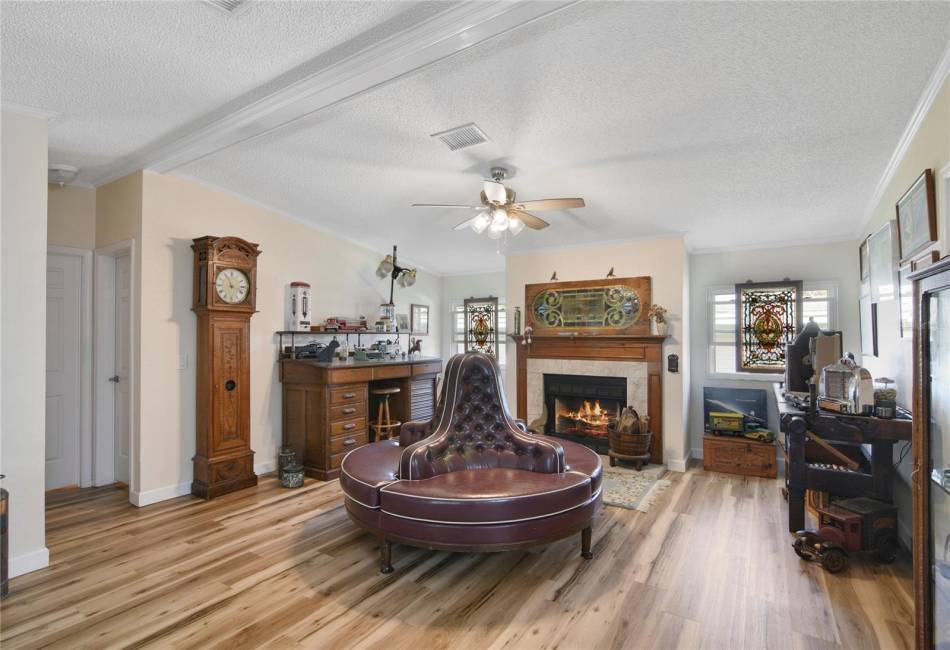 Walk through the front door into the spacious living room with a wood burning fireplace