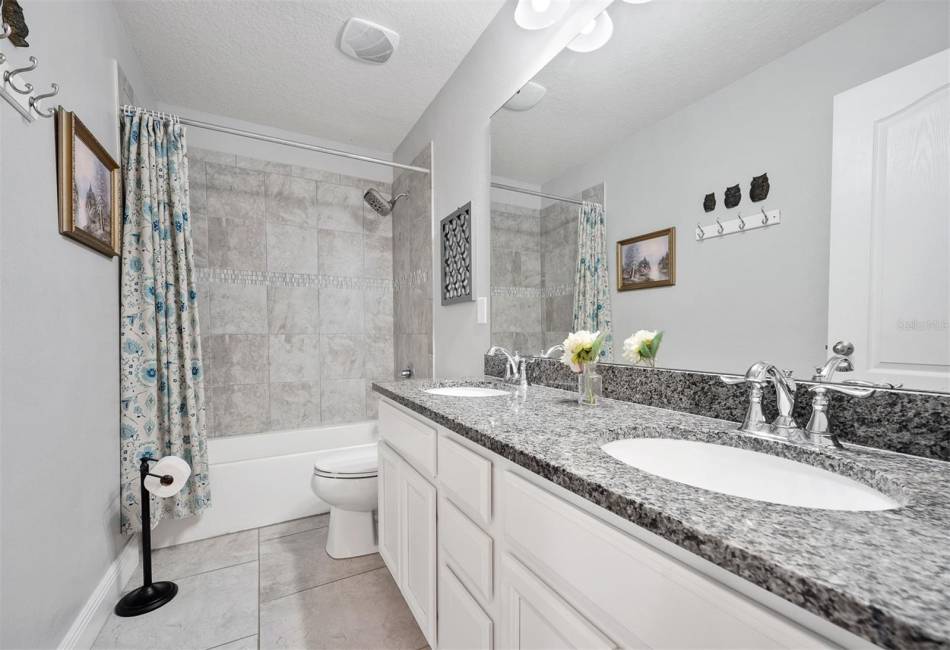 Second full bathroom and located on the 2nd floor. Tile flooring