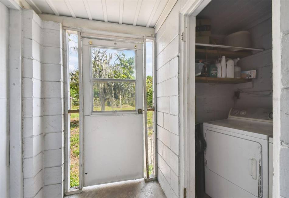 Laundry room on back porch / Door to backyard