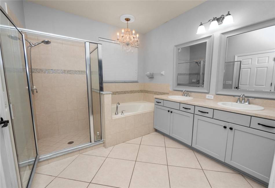 Primary Bathroom with Garden Tub, Dual Vanities, Large Shower, & Walk-In Closet (California Style Shelving)