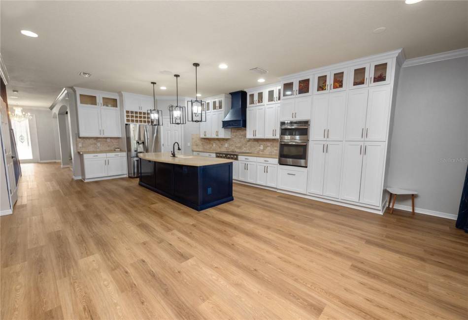 Gourmet Kitchen with Breakfast Bar, Stainless Steel Appliances, Hood vented outside