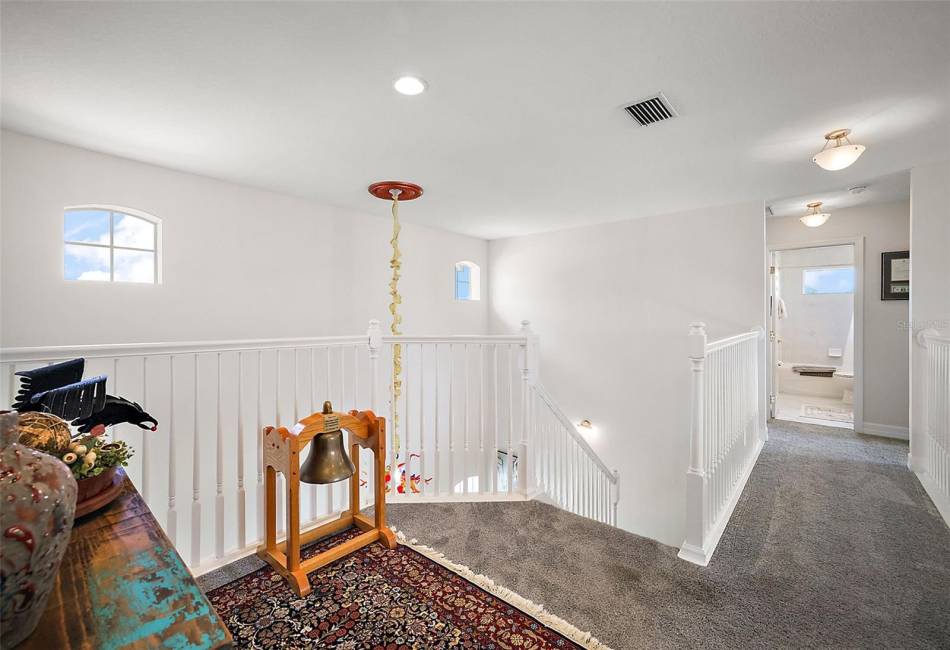 Stairway leading to guest suites and bonus room.