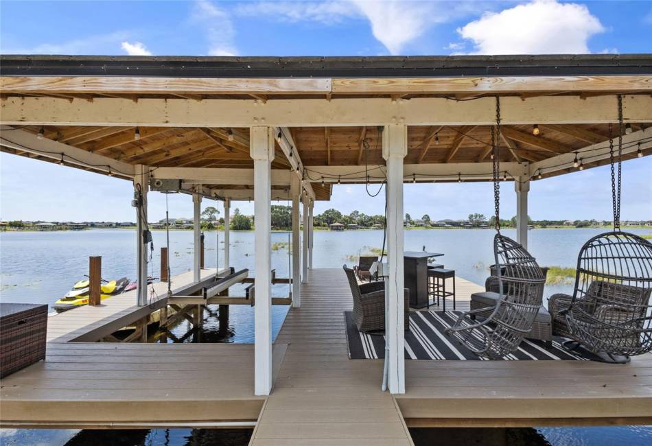 Covered boat lift with relaxing space +/- 20x20 and jet ski lift with floating dock