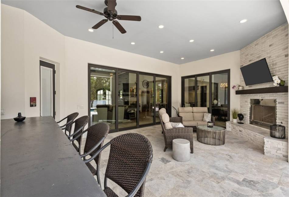 Outstanding outdoor living space with spectacular patio area with pool and 2 spas, loads of room for gatherings on the patio and still some green space behind the patio area.